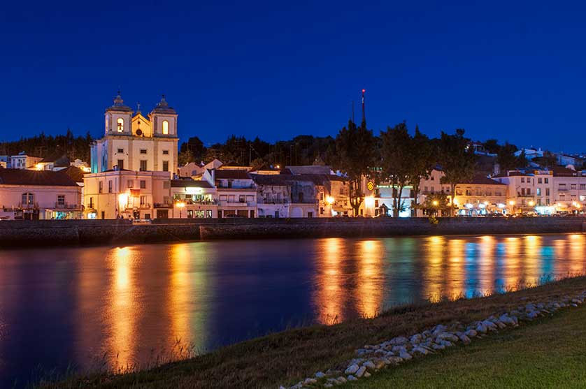 The Igreja de Santiago and Sado River by night.