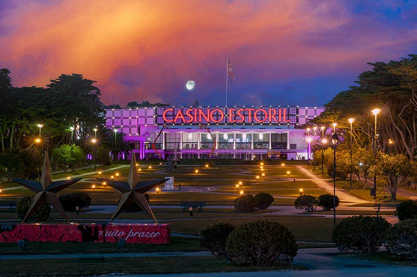 The building and square under a stunning night sky.