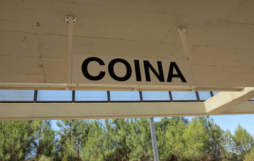 Station sign on the platform.