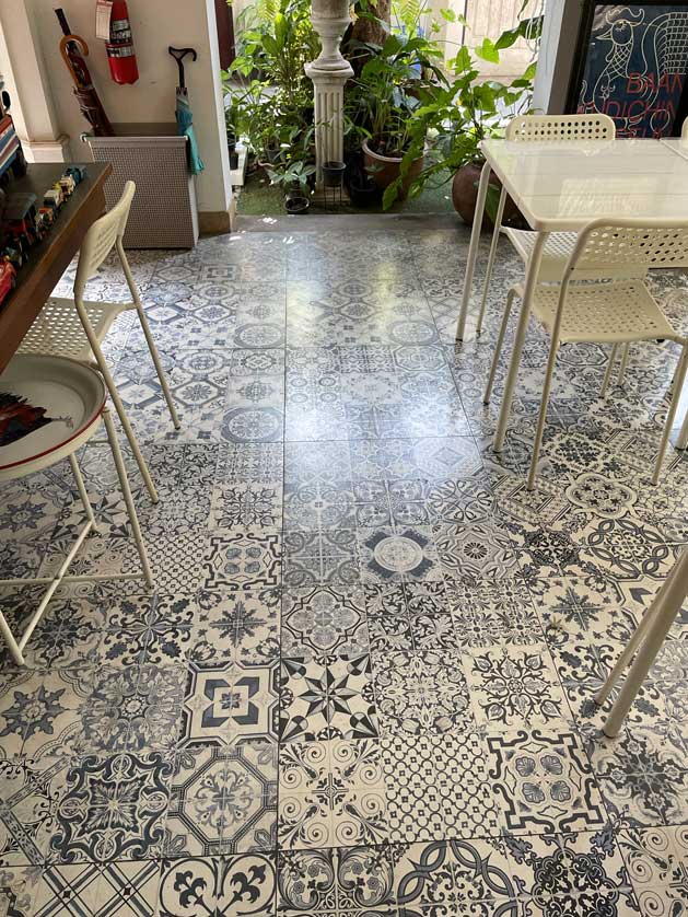 An azulejos tiled floor in the cafe/shop area of the museum.