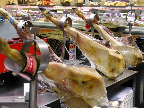 Hams in supermarket, Lisbon, Portugal.