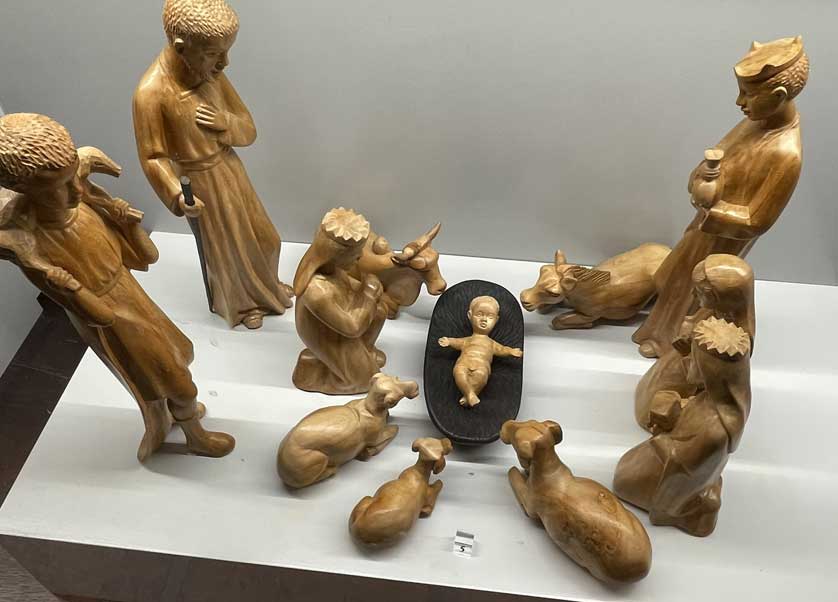This nativity scene is in carved wood.