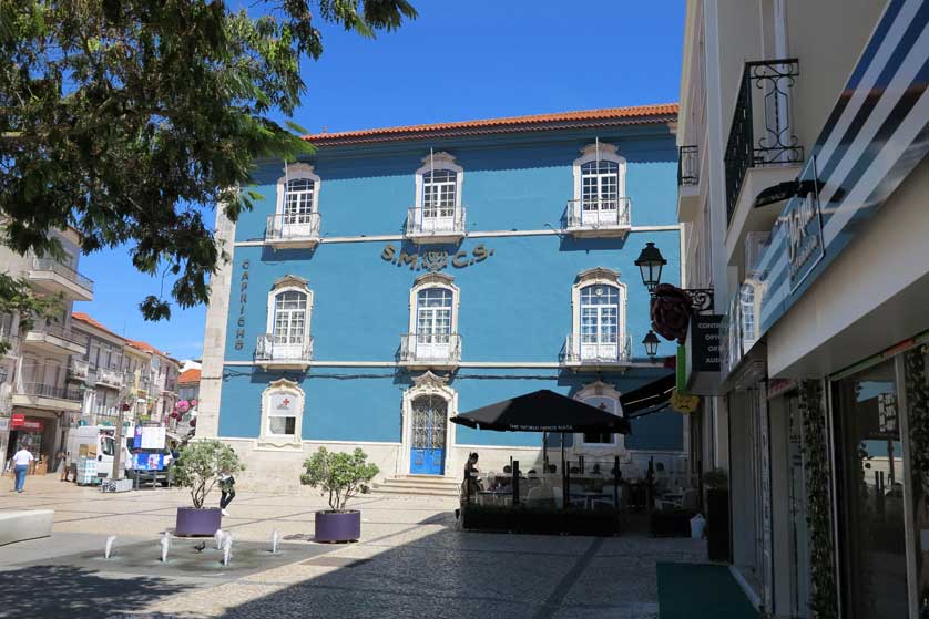 The square has several cafes and shops on its perimeter.