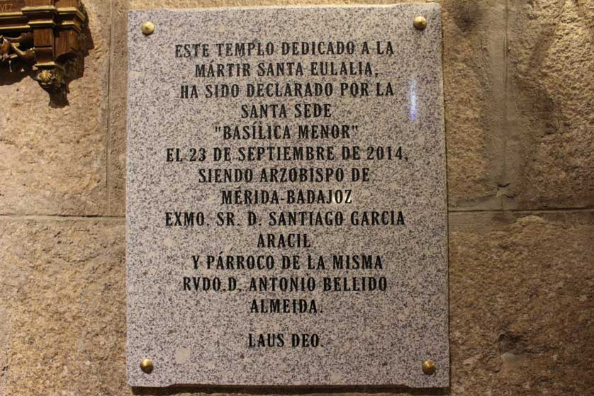 The inscription in Spanish reads that the church is dedicated to the teenage martyr, Saint Eulalia.
