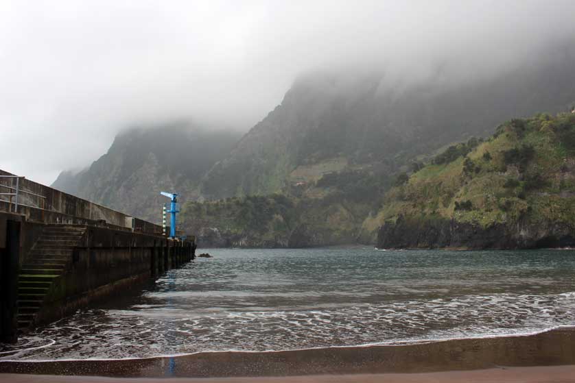 The weather can change suddenly on Madeira here the beach is enveloped in clouds.